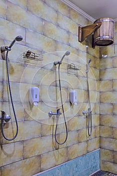 Shower Cabins in Banya Or Bath Interior with Bucket of Cold Water for Dousing