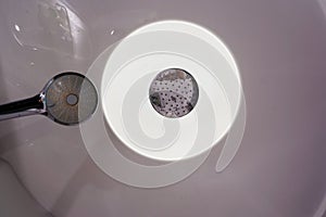 Shower ceiling with ring LED module. the concept of modern economical lighting.