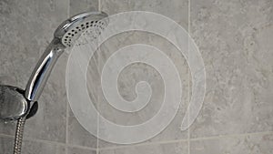 Shower faucet expelling water in a bath, natural resources