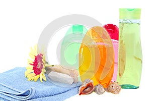 Shower gel, shampoo and towel, isolated.