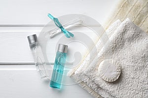 Shower gel and shampoo with towels and cotton buds in the hotel standard set