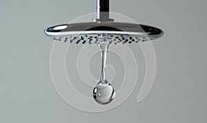 A shower head is dripping water