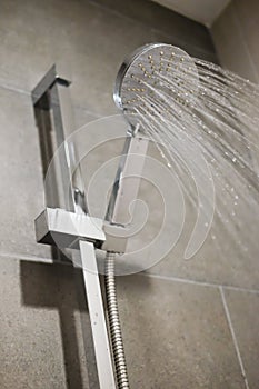 Shower head with flow of water spilling out