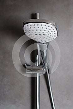 Shower head on grey modern wall. Bathroom shower