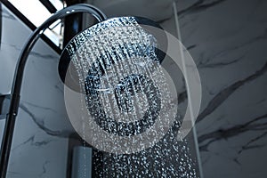 [shower head] shower head in bathroom with water drops flowing