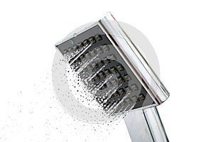 Shower head with water drops on a white background