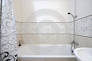 Shower over the bath in the the bathroom