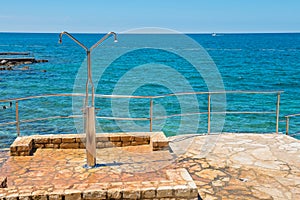 Shower on the rocky beach in Istria