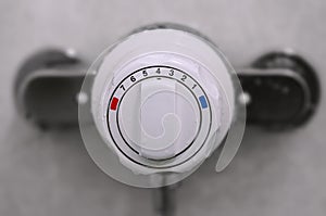 Shower thermostatic power and heat controller close up photo
