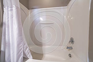 Shower tub combo kit with acrylic wall panel and white shoer curtain