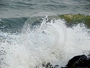 Shower of Water Droplets due to Sea Waves Crashing on Rocks