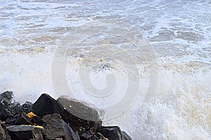 Shower of Water Drops with Splashing of Sea Wave after Hitting Rocks on Shore - Ocean Natural Aqua Background