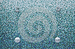 Showers on mosaic tiles photo