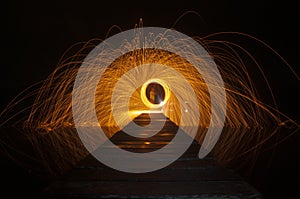 Showers of sparks from spinning steel wool.