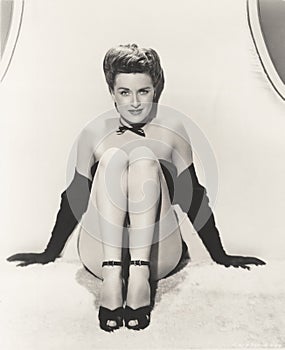 Showgirl posing in opera gloves and ankle strap shoes photo