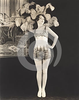 Showgirl wearing feathered headdress