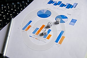 Showing business and financial report. Accounting. Business ideas concept with dice gambling risk currency on keyboard and photo