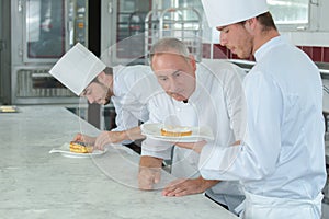 Showing dessert to chef