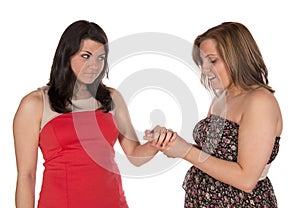 Showing engagement ring to friend