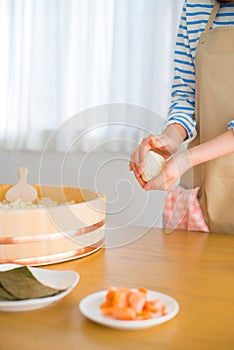 Showing how to make Rice Ball ``Onigiri`` is a typical meal in Japan. Japanese people grab some rice into balls with a shape o photo