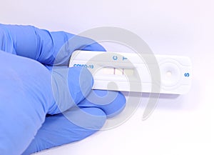 showing positive result with two lines of antigen test to detect