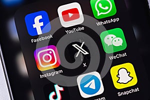 showing social media mobile app icons Facebook, YouTube, WhatsApp, Instagram, Twitter X, WeChat, TikTok, Telegram, Snapchat