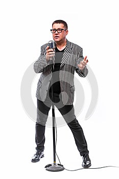 Showman singing in microphone with emotional gesture