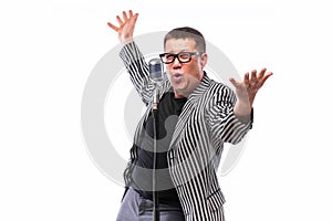Showman singing in microphone with emotional gesture