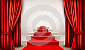 Showroom with red carpet leading to a podium with curtains. photo