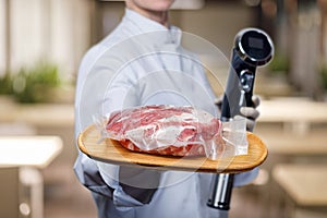 Shows cook sous vide immersion circulator cooker and the meat