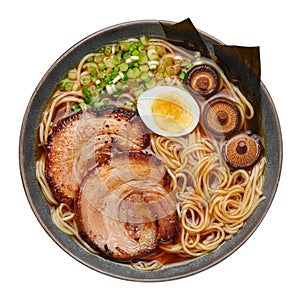 A Shoyu Ramen in gray bowl isolated on white. Japanese cuisine meat noodle soup with chashu pork. Asian food. Top view