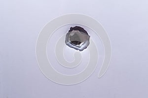 Shrapnel hole on the metal fragment