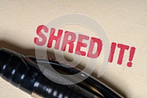 SHRED IT stamped on manilla file folder- privacy concept photo