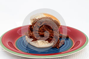 Shredded Beef Sandwich On Colorful Plate