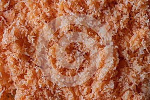 Shredded fresh carrots after juicer  close up  top view