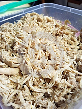 Shredded spicy chicken meats meant to be filling for wrapped chicken rolls