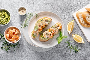 Shrimp and avocado sandwich with baguette and sesame. Top view