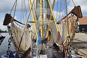 Shrimp boat with nets in the harbour of Zoutkamp