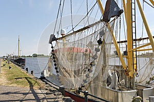 Shrimp boat with nets in the harbour of Zoutkamp The Netherlands