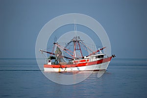 Shrimp boat at sea photo