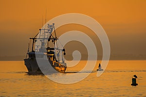 Shrimp Boat at sunset in the gulf