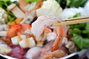 Shrimp with chopsticks photo