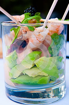 Shrimp cocktail in a glass with letouce