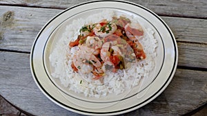 Shrimp creole over white rice photo