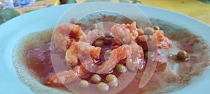 Shrimp dish with sweet and sour seasoning with added peas