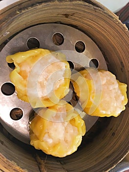 Shrimp dumplings   in steamer  Chinese cuisine.food  is a style of Chinese cuisine.Dim sum in bamboo steamer