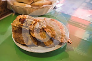 Shrimp empanadas with cheese, accompanied by dressing