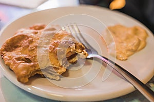 Shrimp empanadas with cheese, accompanied by dressing