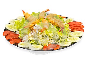 Shrimp Fried on Vegetable Salad in Black Plate. isolated on white background.