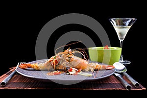 Shrimp grilled and spicy sauce on black background